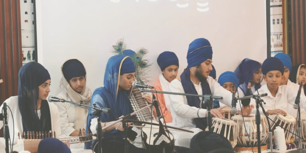 Devotees playing instruments and singing Kirtan